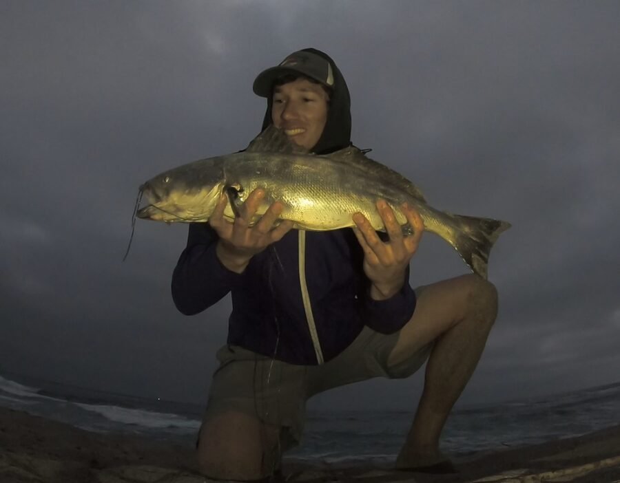 fishing from the beach in the rain