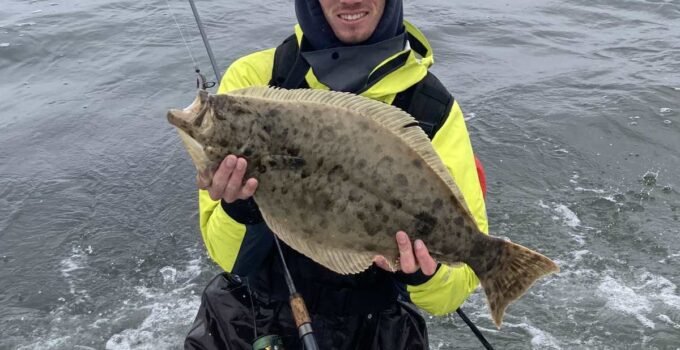 surf fishing with waders and waterproof jacket