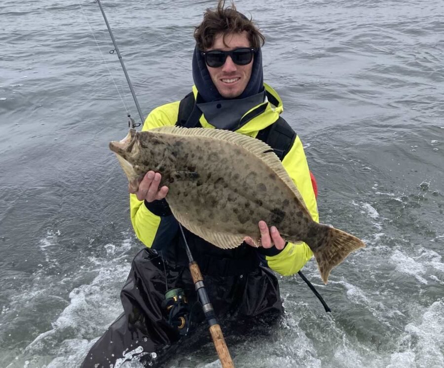 surf fishing with waders and waterproof jacket